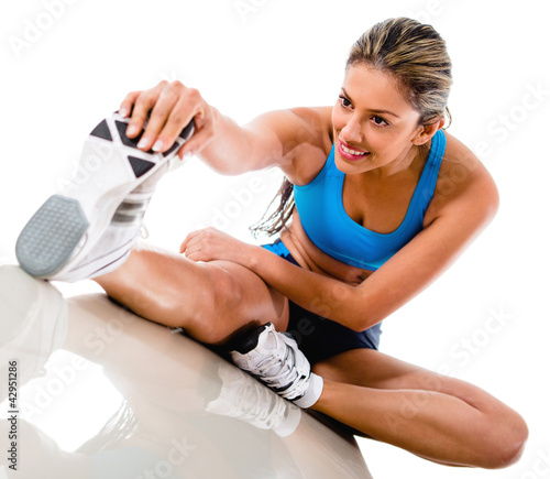 Photo: Woman stretching leg Woman stretching leg