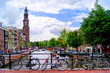 Bicycles lining a bridge over the canals of Amsterdam