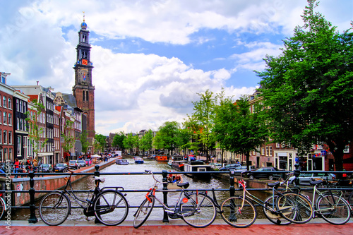 Photo: Bicycles lining a bridge over the canals of Amsterdam Bicycles lining a bridge over the canals of Amsterdam