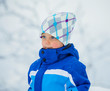 Winter boy throwing snowball