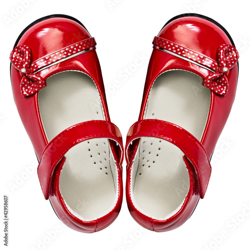Photo: Baby red shoes isolated on white background Baby red shoes isolated on white background