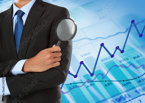Photo: man holding magnifying glass man holding magnifying glass