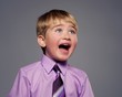 Foto: Funny baby boy in purple shirt Funny baby boy in purple shirt