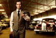 Photo: Businessman with a briefcase in garage Businessman with a briefcase in garage