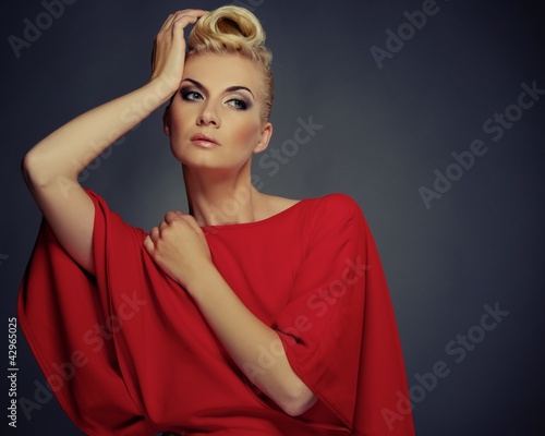 Photo: Fashionable woman in red with creative hairstyle Fashionable woman in red with creative hairstyle