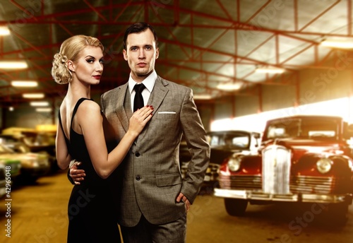 Photo: Couple in retro garage Couple in retro garage