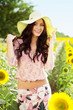 Beautiful lady in sunflower field