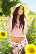 Beautiful lady in sunflower field