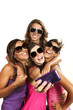 Happy young girls while taking pictures of themselves