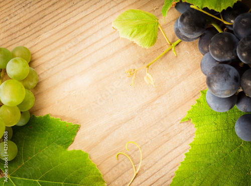 Photo: Grape on wooden table Grape on wooden table