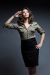 woman in military shirt and black skirt