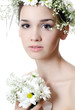 Portrait of the beautiful girl with flowers in hair