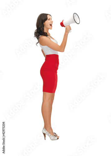 Photo: woman in a dress with megaphone woman in a dress with megaphone