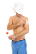 Photo: Man in hat applying sun block creme on arm Man in hat applying sun block creme on arm