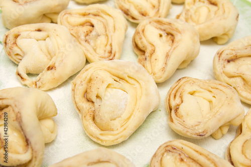 Photo: Half-finished product of a roll with cinnamon Half-finished product of a roll with cinnamon