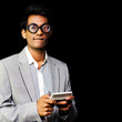 Nerd playing handheld video game