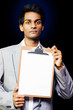Young professional man with clipboard