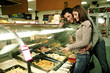 A couple choosing a ready-made food