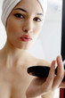 Woman checking her pouty lips 