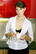 Sexy woman holding a cup of coffee 