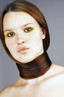 Woman tying her long hair around her neck