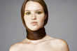 Woman tying her long hair around her neck