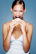 Woman eating bread