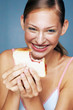 Woman eating bread
