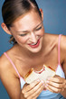 Woman eating bread