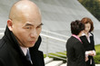 Bald man with bad intention towards the two business women