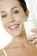 Woman holding a glass of milk