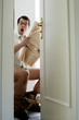 Man on toilet bowl in shock