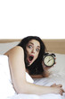 Photo: Woman waking up late Woman waking up late