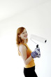 Woman holding a paint roller