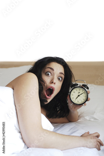 Photo: Woman waking up late Woman waking up late
