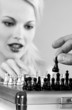 Woman playing chess game