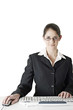 Bespectacled businesswoman using computer