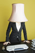 Businesswoman with lampshade on head
