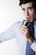 Businessman talking on a tin can telephone