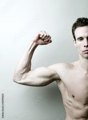 Photo: Man showing off his muscle Man showing off his muscle