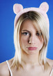 Woman in cute bear hair band sulking