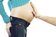 Hand touching a pregnant woman's stomach