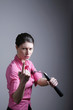 Businesswoman showing off his martial art skill