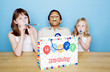 Kids playing with party blowers