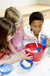 Children baking cake in the kitchen