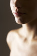 Close-up of a woman's face and chest