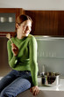 Woman holding a wooden ladle smiling