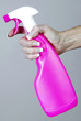 Hand holding a spray bottle