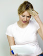 Foto: Woman thinking while reading Woman thinking while reading