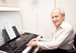 Pleased Senior Man Playing Piano
